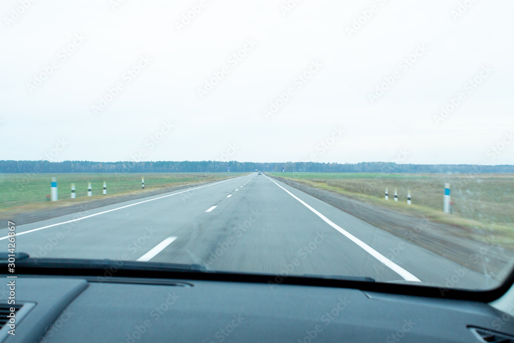 Fototapeta premium view of the road from the window of a moving car.