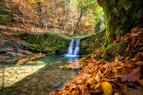 Fototapeta Naklejka Na Ścianę i Meble -  Beautiful waterfall at the mountain in autumn landscape