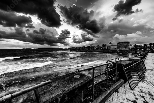 Dramatic sky over Alghero at sunset in black and white
