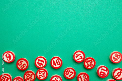 bingo numbers on green background - flat lay style
