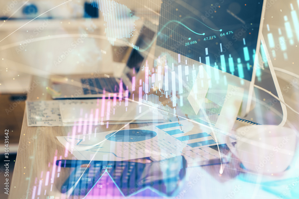 Financial graph colorful drawing and table with computer on background. Double exposure. Concept of international markets.