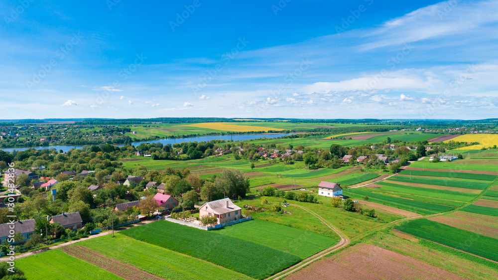 European village, river, forest. Aerial view.