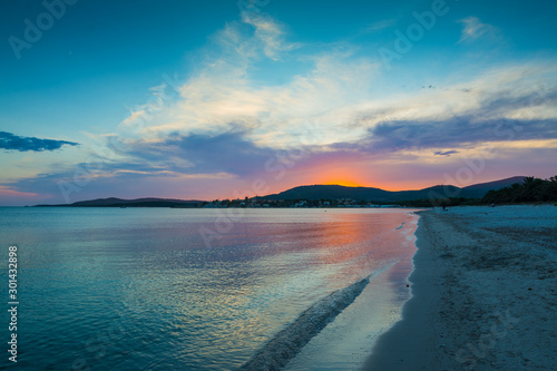 Fototapeta Naklejka Na Ścianę i Meble -  Blue and orange sky over the sea at sunset in Alghero