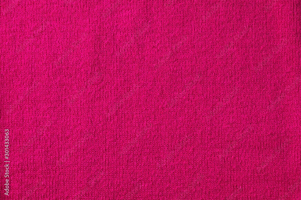 Bright pink knitted fabric background, copy space for text, top view Bright pink knitted fabric background, copy space for text, top view