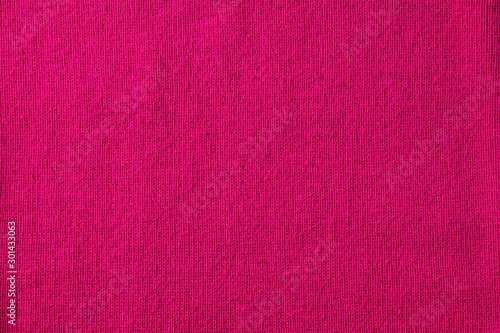 Bright pink knitted fabric background, copy space for text, top view
