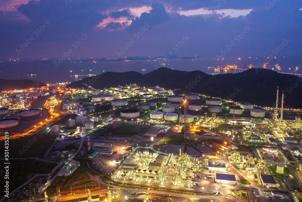 Aerial view of twilight petrochemical oil refinery plants,sea ...