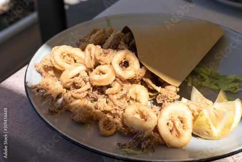 Cartoccio containing fried shrimp