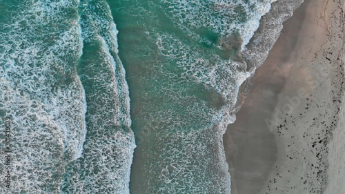 Aerial looking straight down onto large swell and waves. Overhead downward view of sea waves
