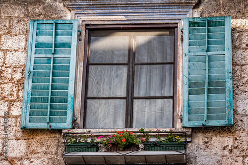 Windows with shutters. Cityscape of the old town.