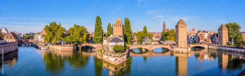 Panoramic view of the Ponts Couverts (covered bridges), a medieval set of bridges and defensive towers on the river Ill at the entrance of the Petite France historic quarter in Strasbourg, France.