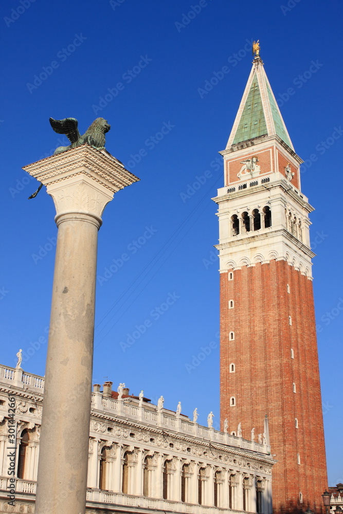 Saint Mark tower and the winged Lion in Venice, Italy