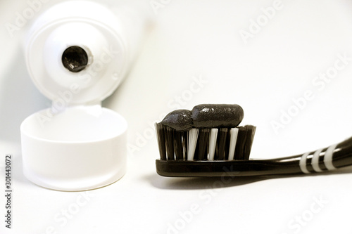 Natural coal.Black and white toothbrush. Healthy and clean teeth.