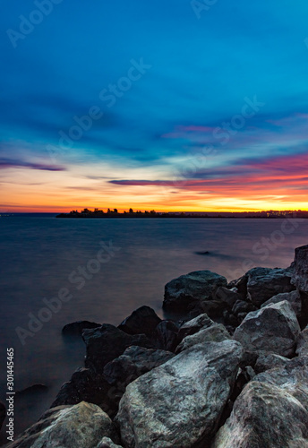 Sunset boulders beach landscape. Rocky boulders beach sunset view. Sunset boulders beach panorama. Sunset boulders beach view