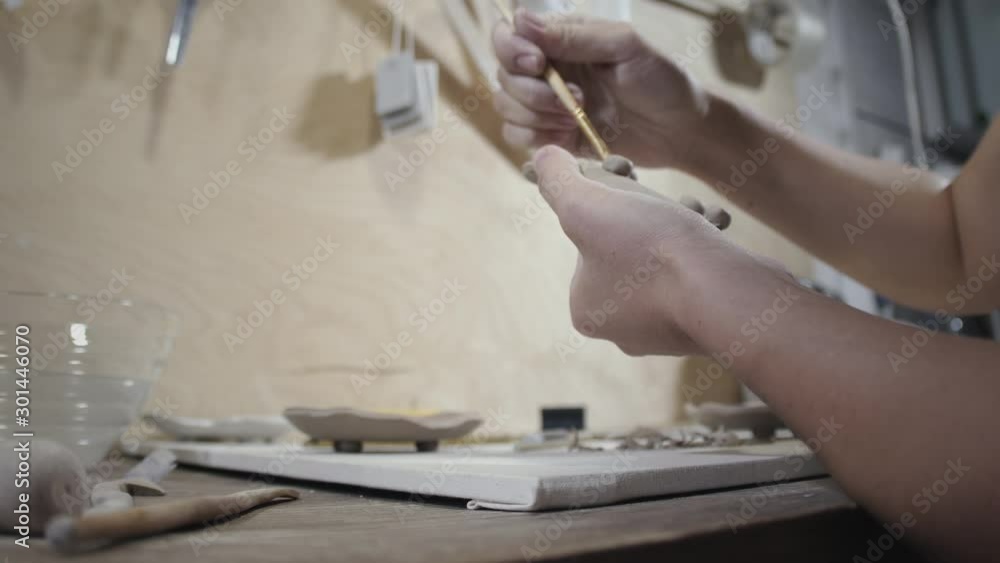 Woman Cover Raw Clay Product with Water