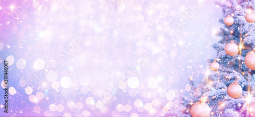 Fototapeta Naklejka Na Ścianę i Meble -  Christmas and New Year holidays background. Glitter lights backdrop. Winter season. Text space. Closeup of Christmas-tree. Elements of this Image Furnished by NASA.