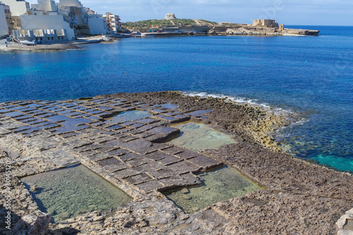 Obraz na płótnie Salt pans along the waterfront with the Il-Qolla I-Badja battery, Marsalforn, Gozo, Malta, Europe w salonie