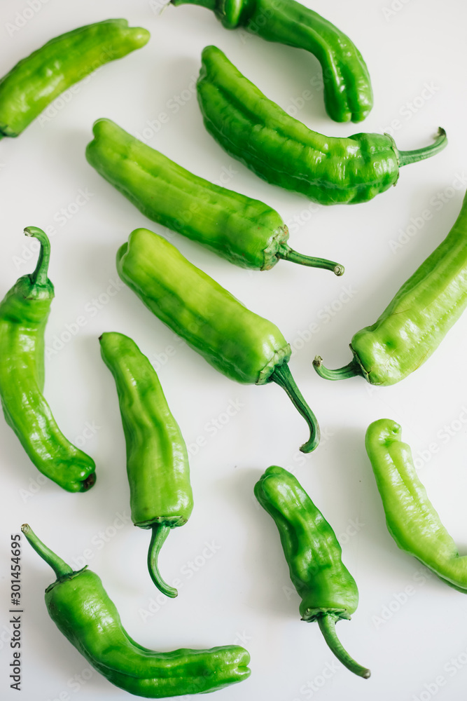 Green peppers isolated on white background. Top view Green peppers isolated on white background. Top view