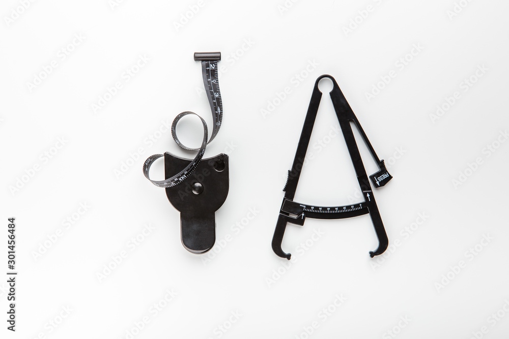 Measuring tape and caliper used in measuring body fat percentage Measuring tape and caliper used in measuring body fat percentage