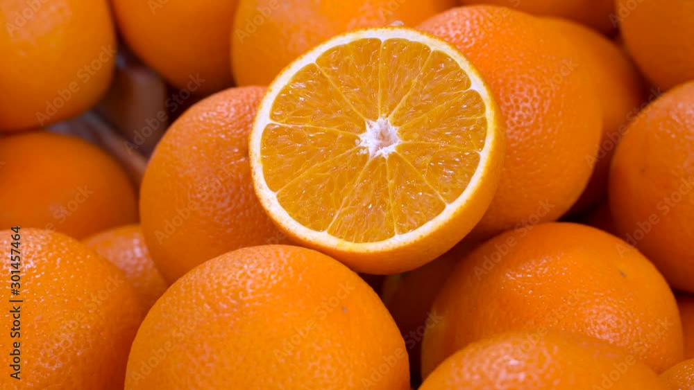 A crop of fresh oranges background close up A crop of fresh oranges background close up