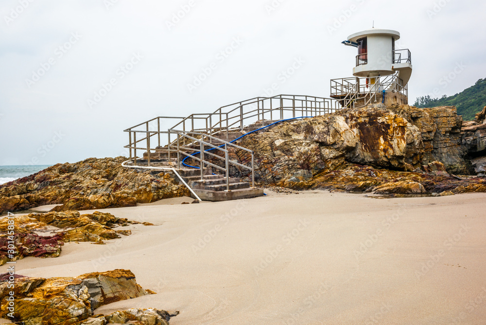 The lifeguards observation tower on the rocks and sand of Big Wave Beach in Hong Kong at sunrise - 6 The lifeguards observation tower on the rocks and sand of Big Wave Beach in Hong Kong at sunrise - 6