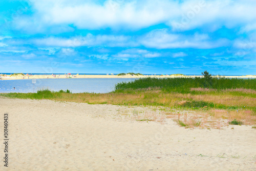 sandy empty beach on the background of the lake and blue sky1 photo