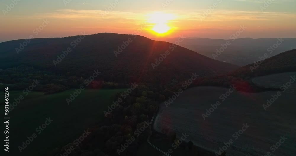 Autumn forest drone aerial shot at sunset. Overhead view of foliage trees in Hungary. Inspiring autumn season landscape panorama. Autumn forest drone aerial shot at sunset. Overhead view of foliage trees in Hungary. Inspiring autumn season landscape panorama.