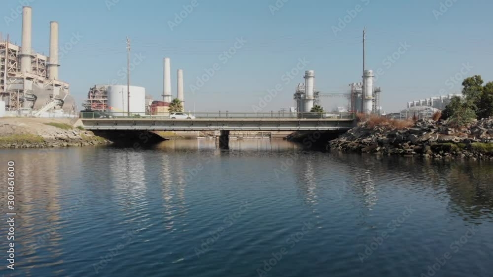 Dolly toward busy road, cars and Natural Gas Plant, Long Beach, California Dolly toward busy road, cars and Natural Gas Plant, Long Beach, California