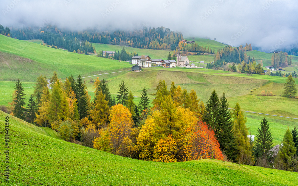 Autumnal panorama at Santa Magdalena village in the famous Val di Funes. Trentino Alto Adige, Italy.