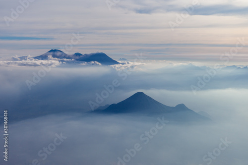 Aerial view of different volcanoes on Java Island. The fog adds to a mystical appearance of these sleeping beauties.