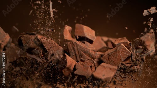 Super slow motion of flying group of raw chocolate pieces. Filmed on high speed cinema camera, 1000fps.