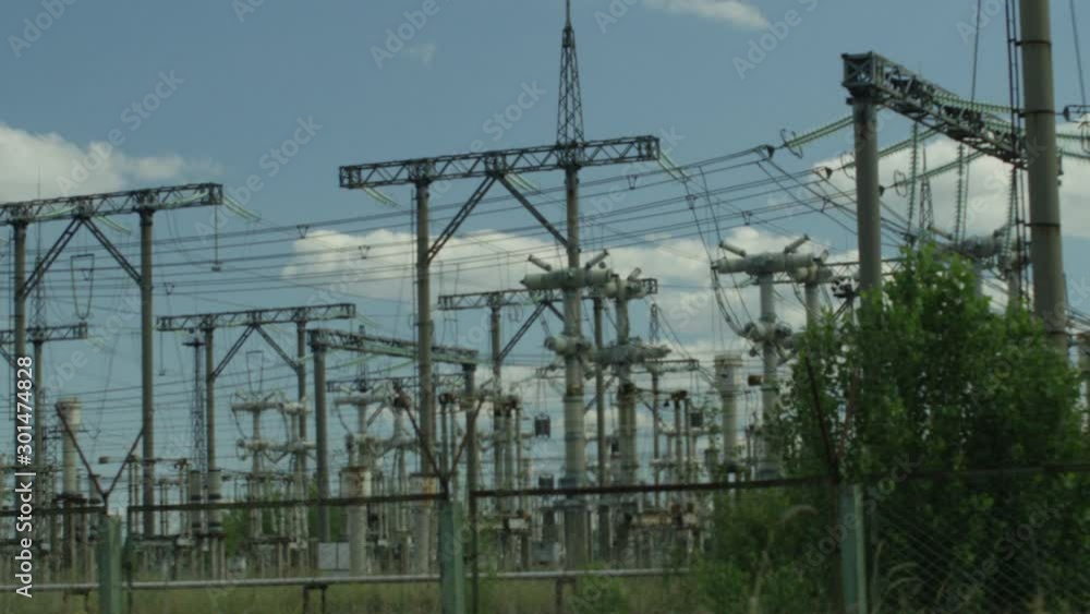 Power Plant Next to Chernobyl Nuclear Reactor. Tracking Shot of Power Relays in Chernobyl, Ukraine Power Plant Next to Chernobyl Nuclear Reactor. Tracking Shot of Power Relays in Chernobyl, Ukraine