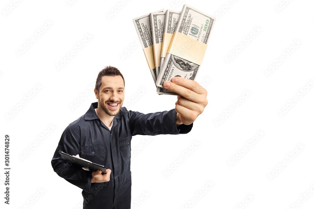 Repairman with a clipboard holding stacks of money Repairman with a clipboard holding stacks of money