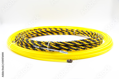 Bild auf Leinwand Yellow and Black Electrical Wire Threader