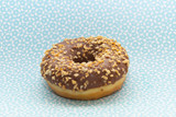 donut on blue with pattern background, close up view