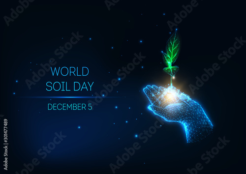Futuristic World Soil Day concept with glow low poly hand hold green sprout on dark blue background.