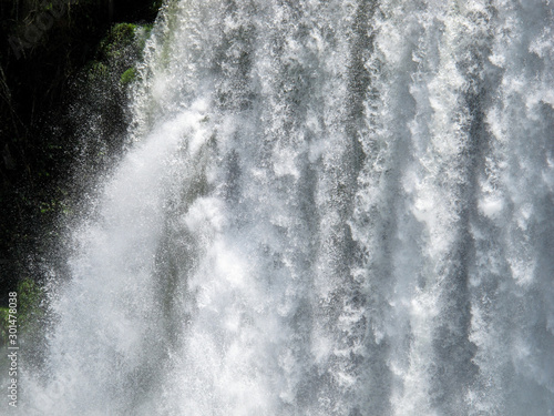 Iguazu Falls. A waterfall is an area where water flows over a vertical drop or a series of steep drops in the course of a stream or river iguazu
