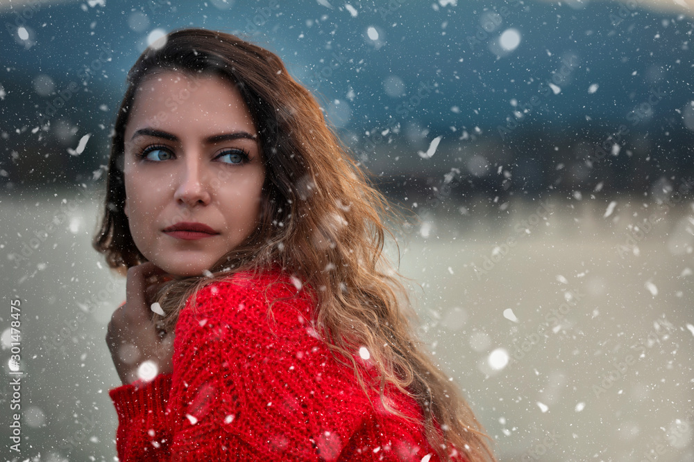pretty young woman on a snowy and cold day pretty young woman on a snowy and cold day