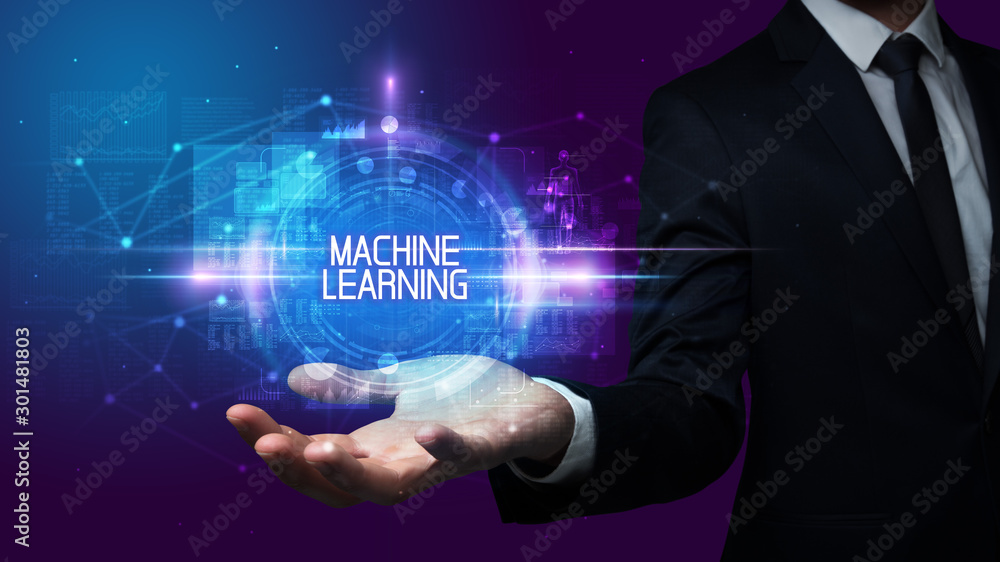 Man hand holding MACHINE LEARNING inscription, technology concept Man hand holding MACHINE LEARNING inscription, technology concept