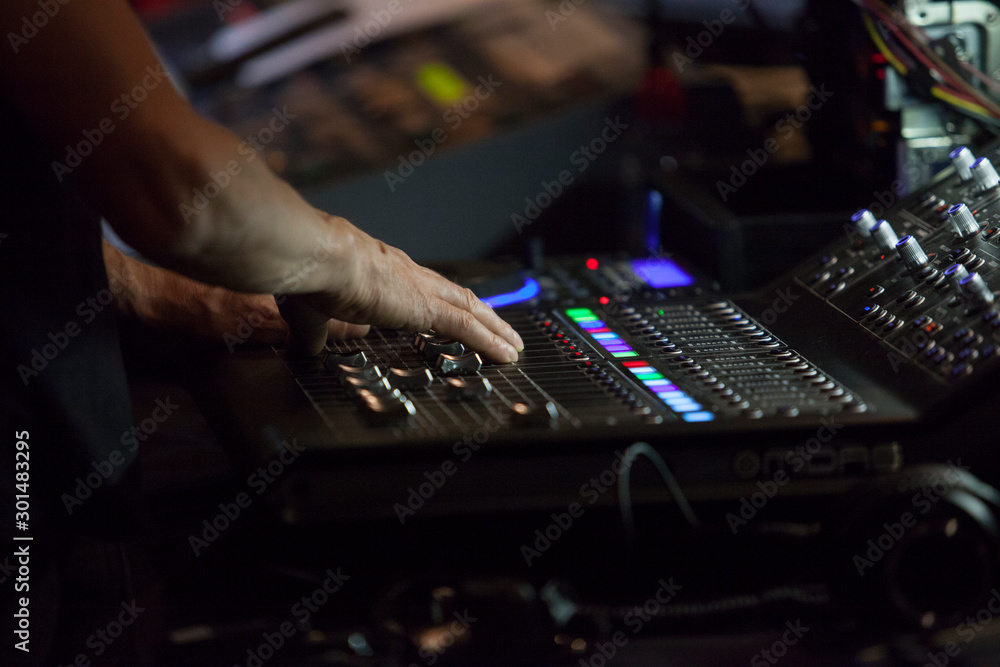 Console controller hand working during theatre play Console controller hand working during theatre play