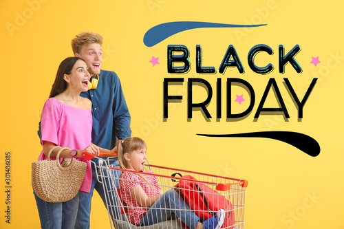 Family with shopping cart a...