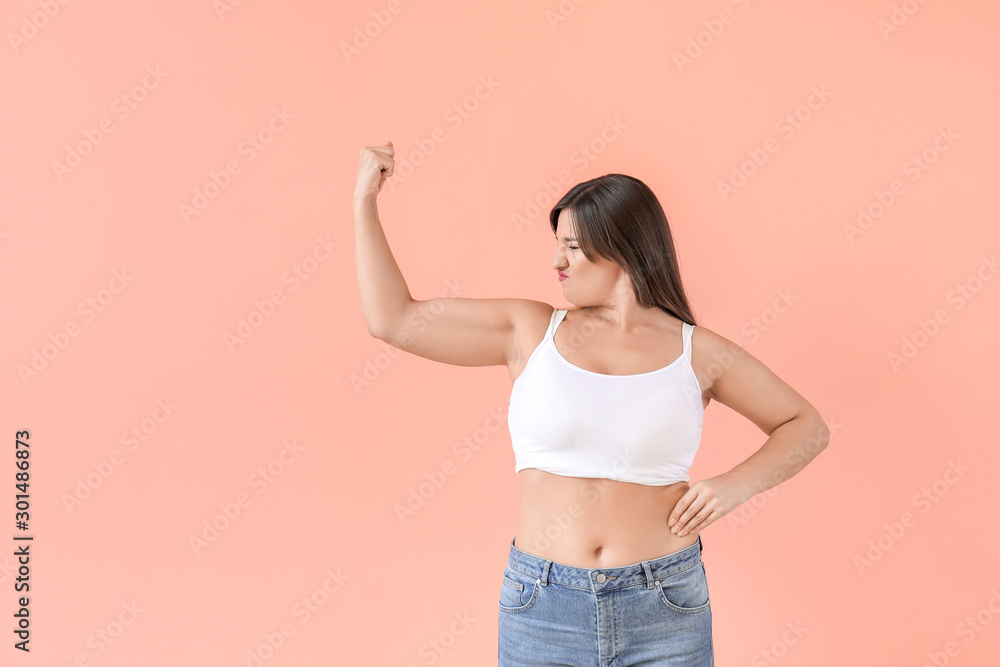 Portrait of body positive woman on color background - obrazy, fototapety, plakaty 