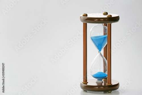 Crystal hourglass on light background