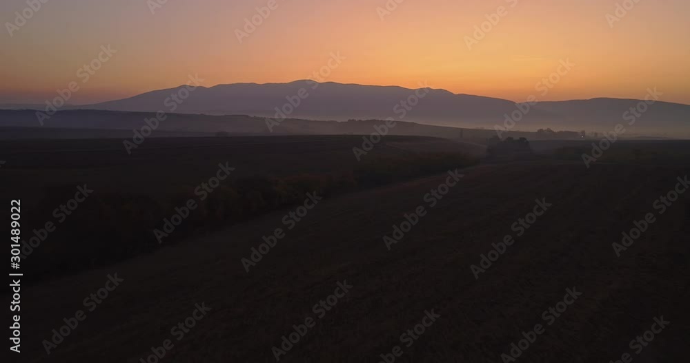 Aerial drone fly over northern Hungarian landscape at sunrise. Northern Matra mountains and hills. Aerial drone fly over northern Hungarian landscape at sunrise. Northern Matra mountains and hills.