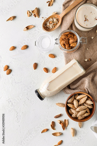 Tasty almond milk on white background