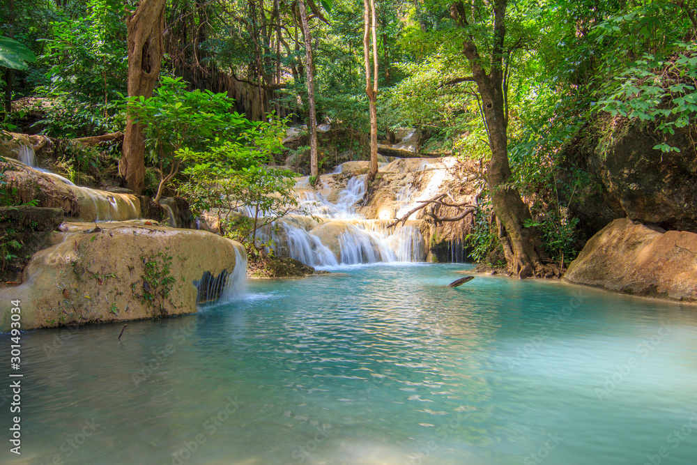 Naklejka premium Waterfalls In Deep Forest at Erawan Waterfall in National Park Kanchanaburi Thailand