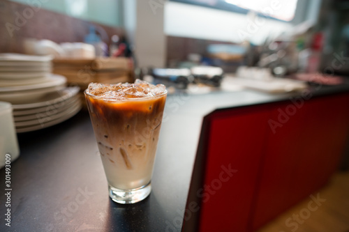 iced coffee put on black table in mini cafe
