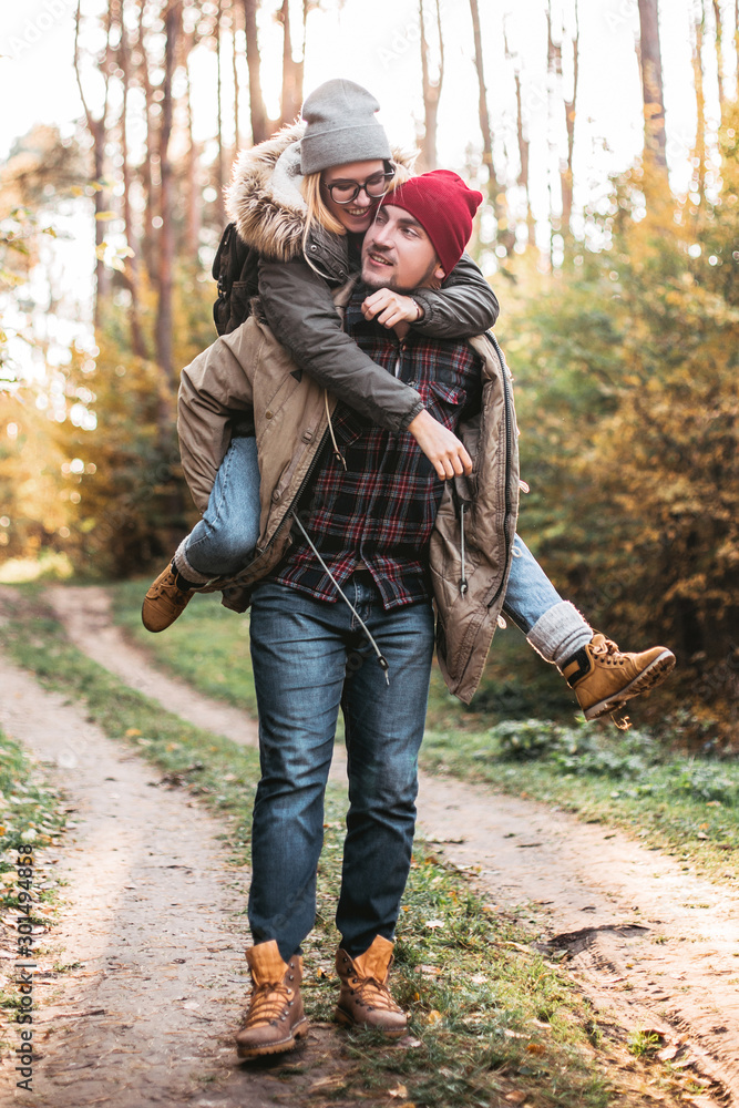 Traveler couple in love so fun in the forest. Concept of trekking, adventure and seasonal vacation. Traveler couple in love so fun in the forest. Concept of trekking, adventure and seasonal vacation.
