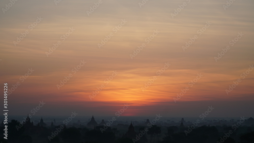 Landscape Bagan Myanmar with Silhouettes of ancient Buddhist temples, Orange sky sunset