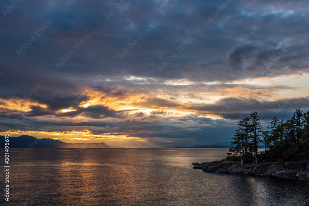 View of ocean sunset over mountains in beautiful British Columbia.