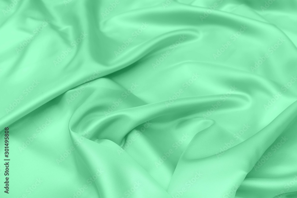 green satin fabric texture soft blur background green satin fabric texture soft blur background